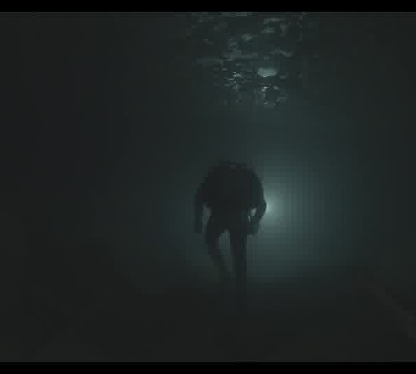 Silhouette_of_a_diver_swimming_front_of_the_light_in_a_dark_underwater_cave_16093029